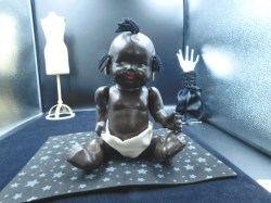 11' 'BLACK COMPO BABY DOLL, BLUE ROMPER, TOPKNOTS, EARRINGS #1304